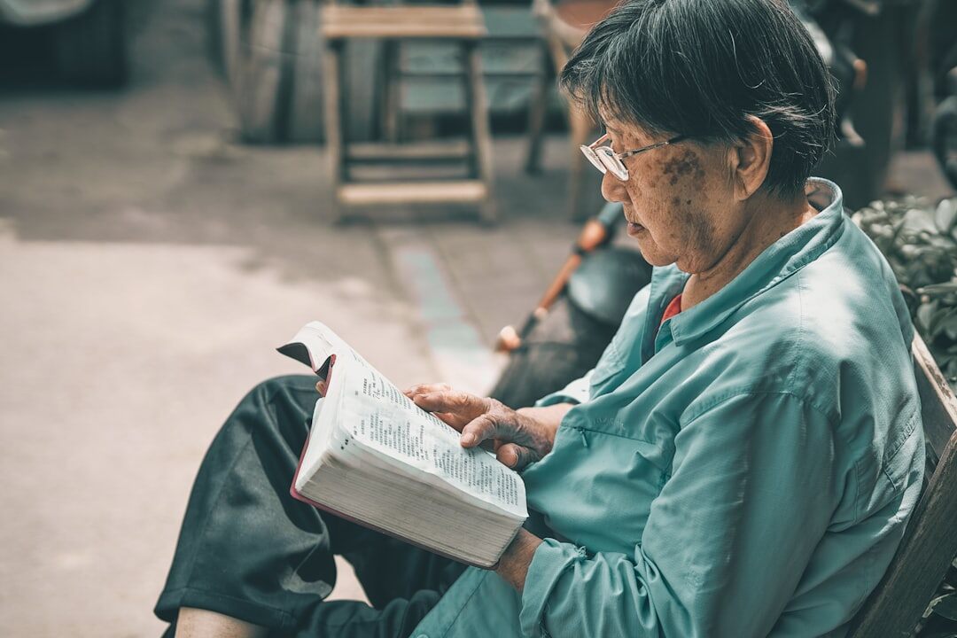 elderly woman writing notes