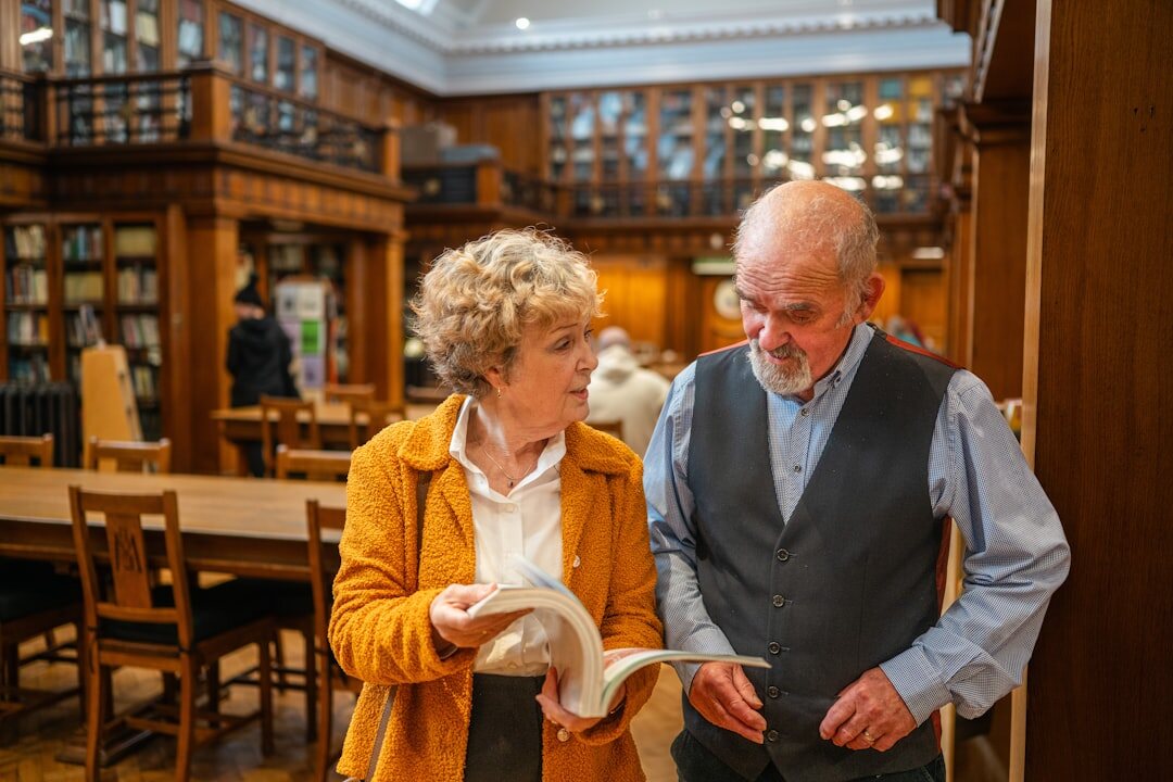 elderly couple checking documents