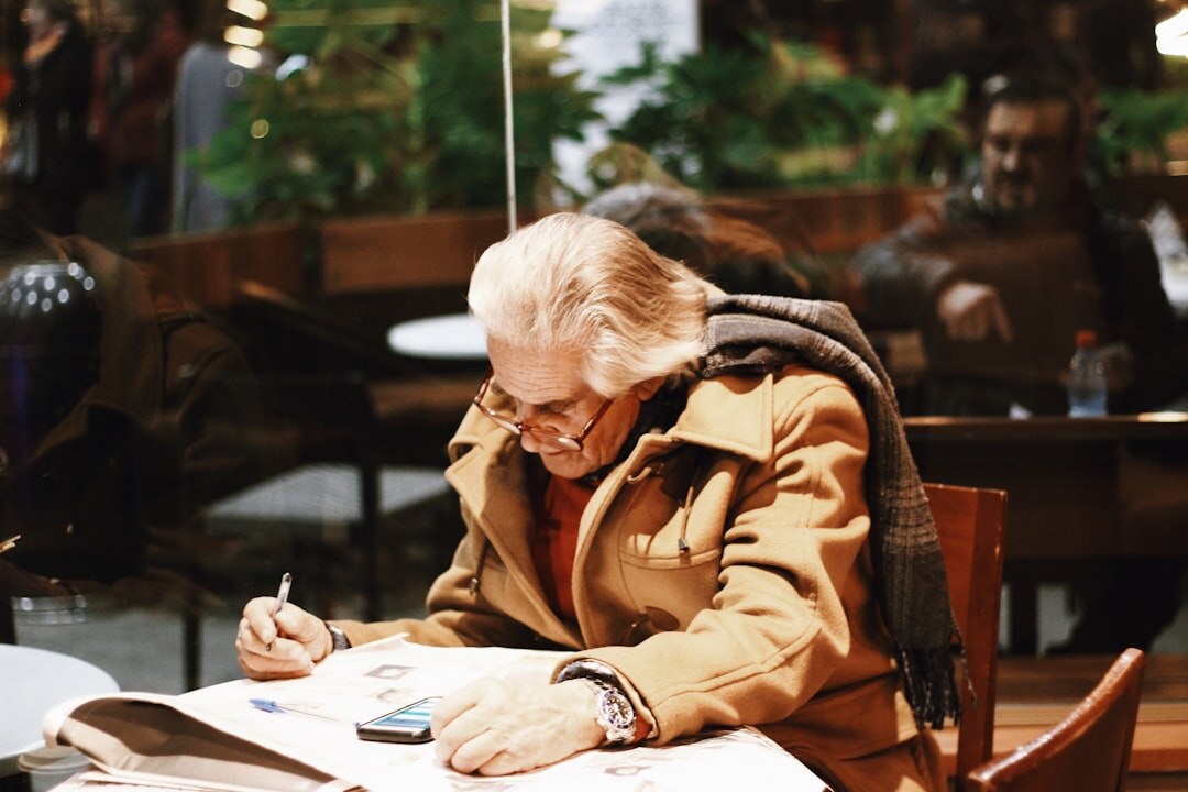 elderly woman checking documents